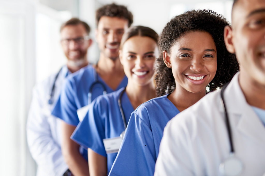 Healthcare staff looking towards camera with smile.